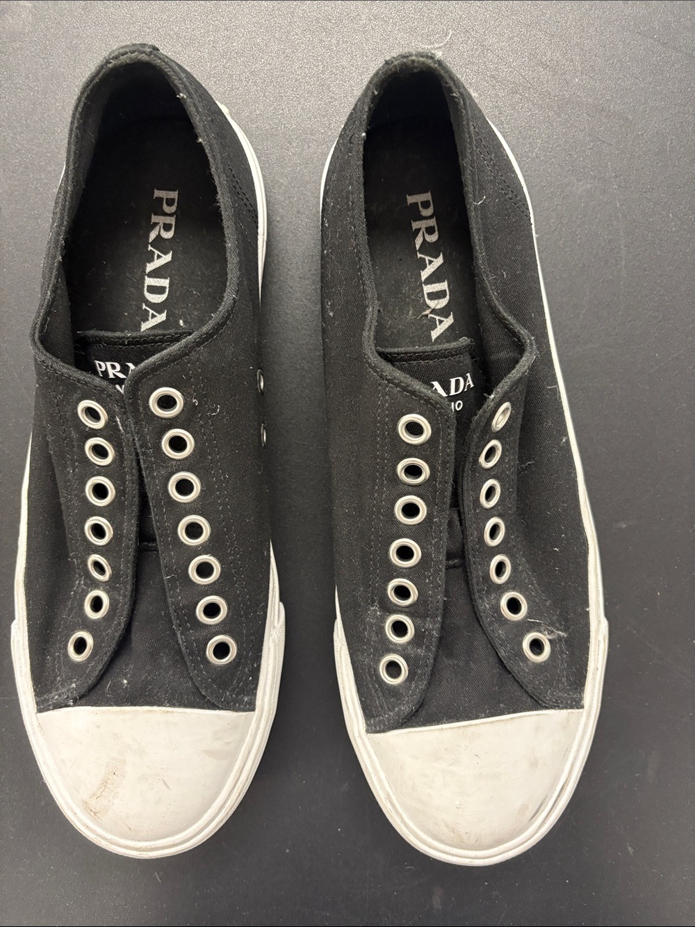 Prada Black Canvas Slip-On Sneakers with White Toe Cap